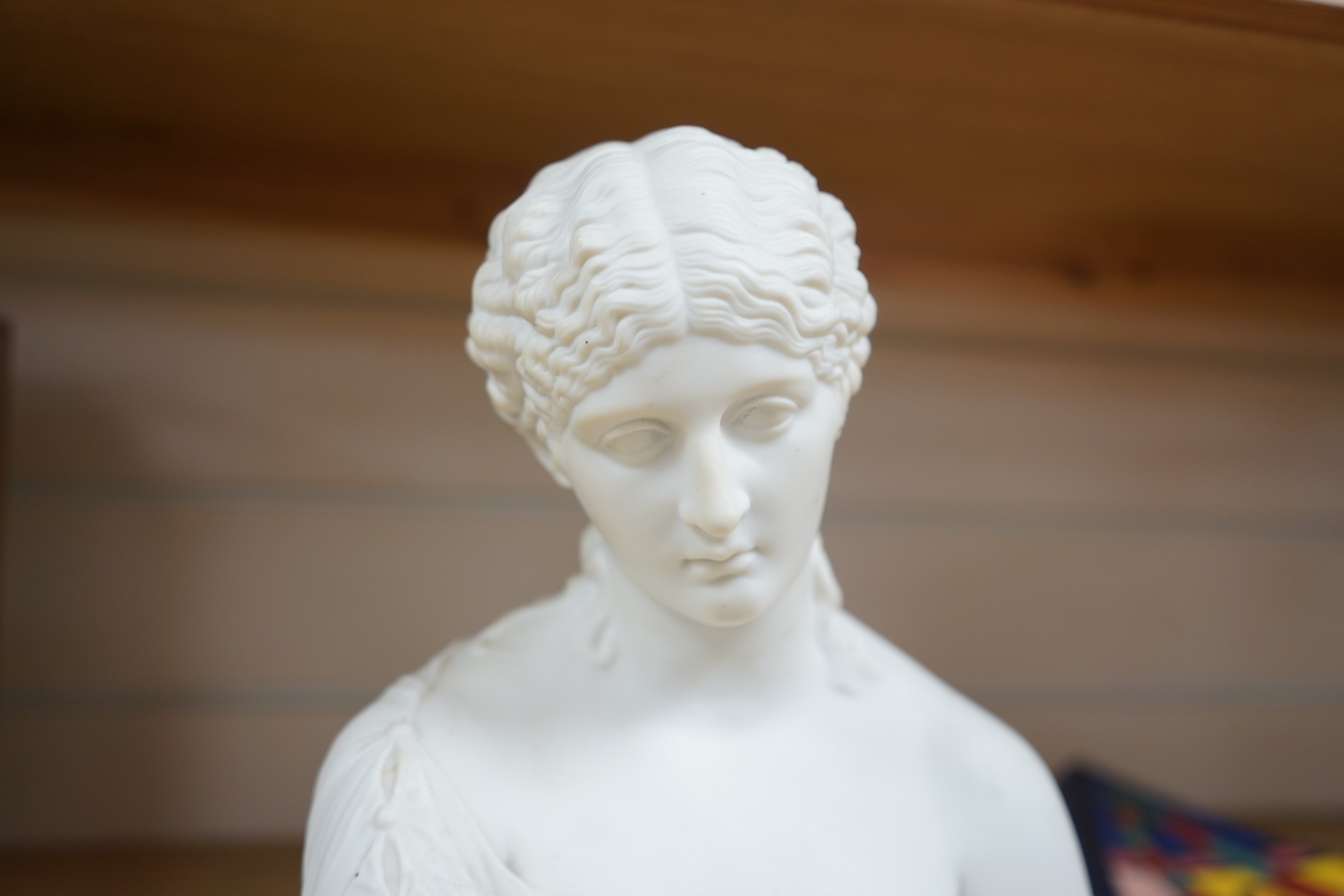 A Parianware bust of Clytie, 28cm high. Condition - good